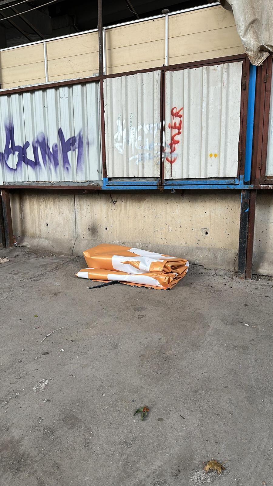 Rescued before landfill — a retired billboard, folded and waiting for pickup